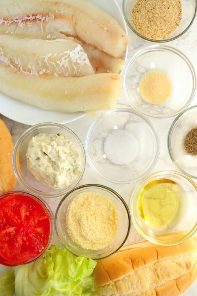 Closeup overhead shot of individual parmesan crusted cod ingredients in bowls on table. 