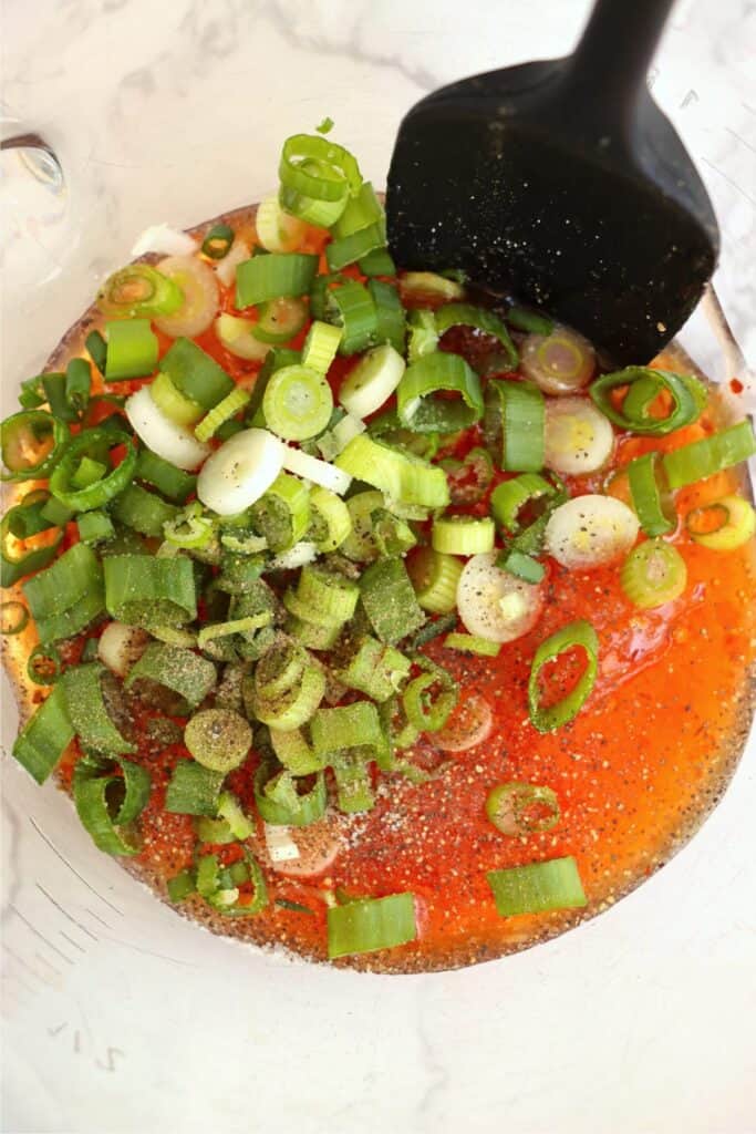 Closeup overhead shot of sweet chili sauce marinade ingredients in bowl