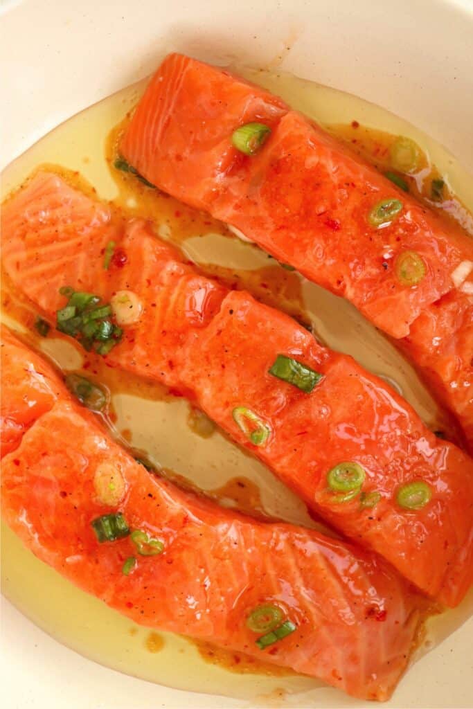 Closeup overhead shot of sweet chili salmon in skillet