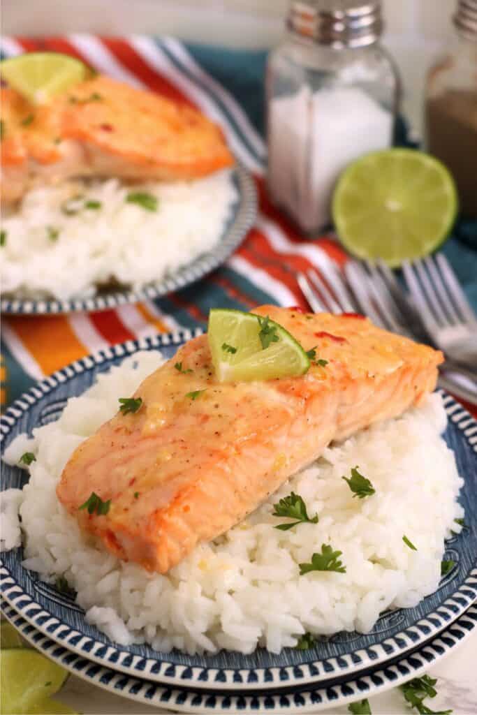 Baked salmon with mayonnaise on bed of rice.