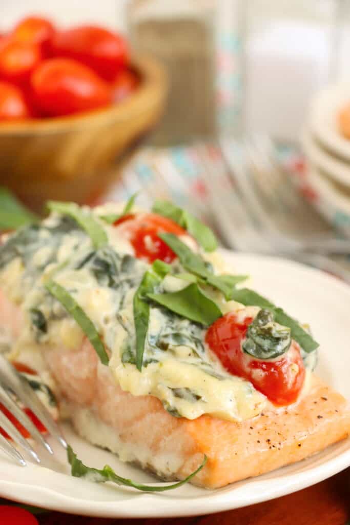 Closeup shot of plate with salmon florentine filet. 