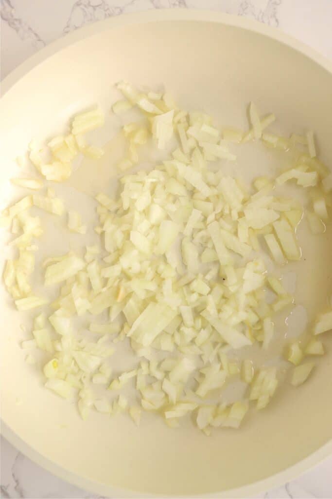 Overhead shot of skillet full of onions. 