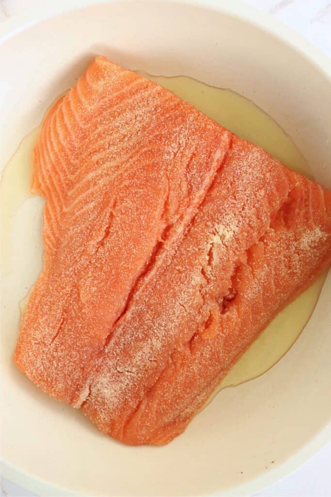 Overhead shot of salmon filet in skillet