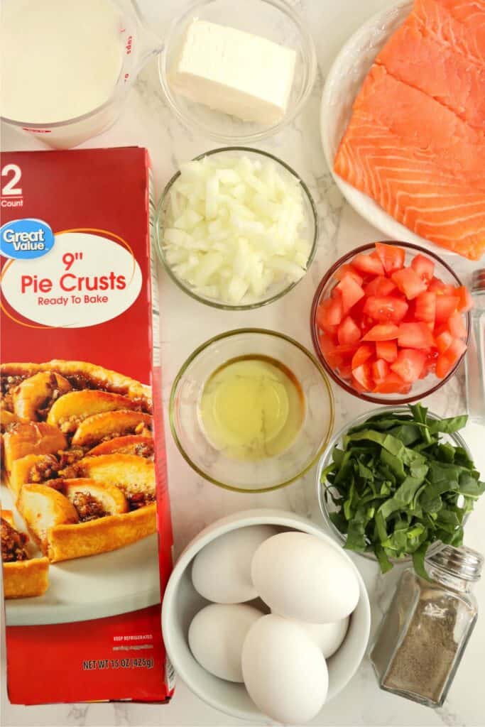 Overhead shot of individual salmon spinach quiche ingredients. 