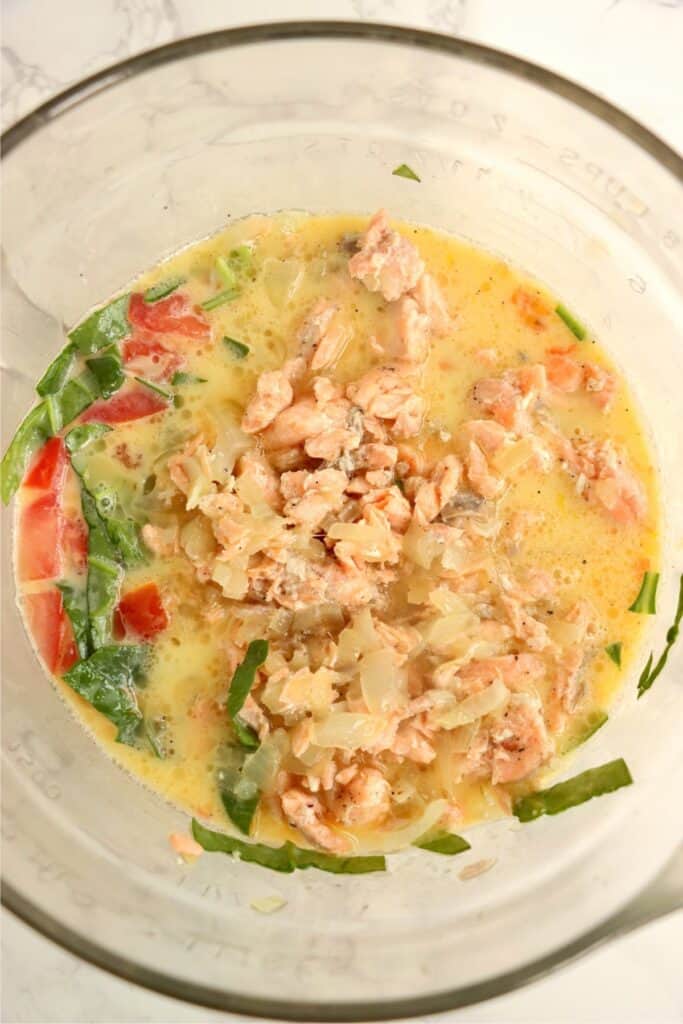 Overhead shot of uncooked quiche ingredients. 