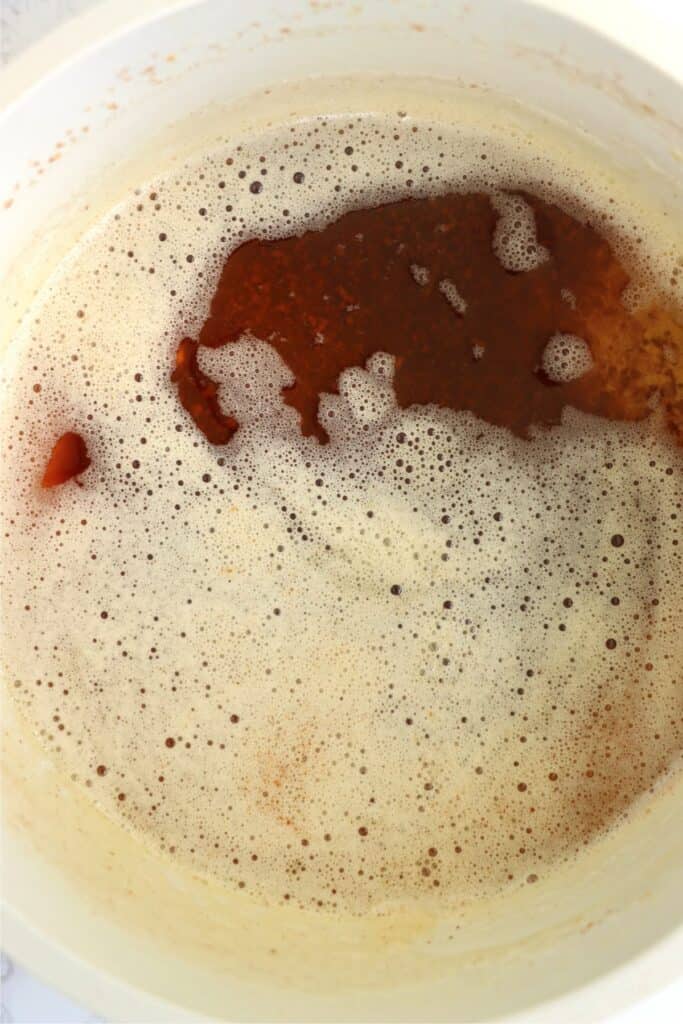 Closeup overhead shot of brown butter in saucepan.