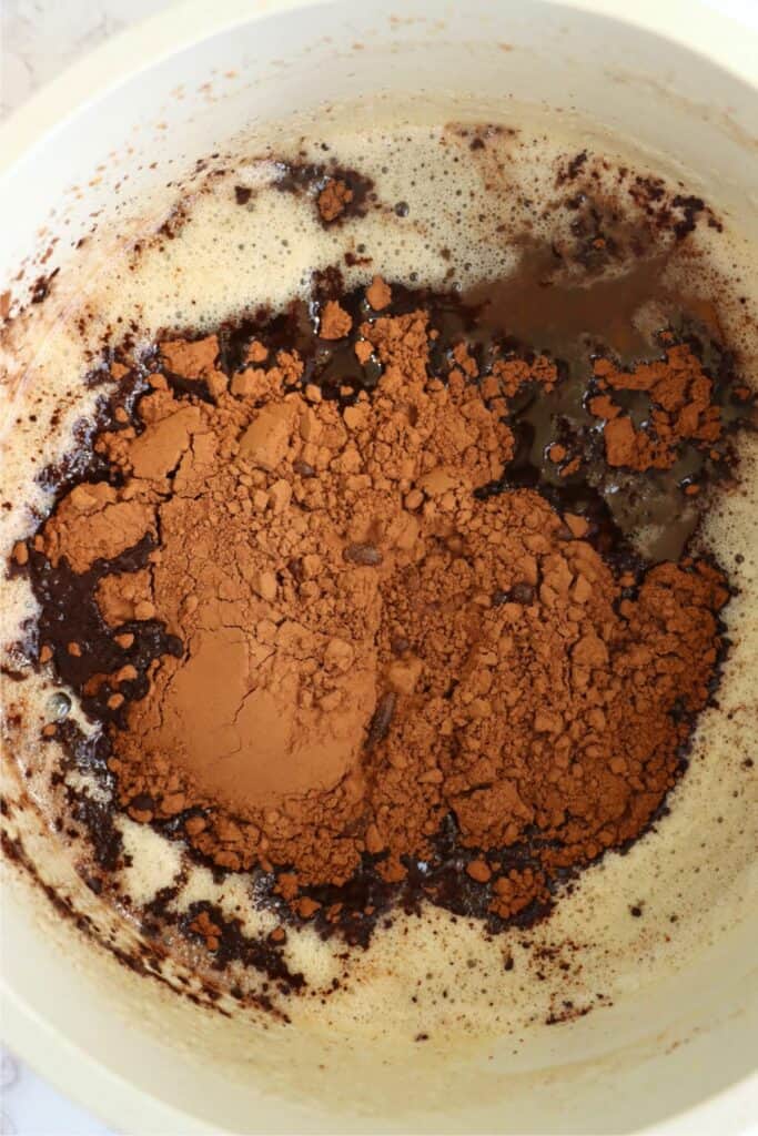 Closeup overhead shot of brown butter with cocoa powder. 