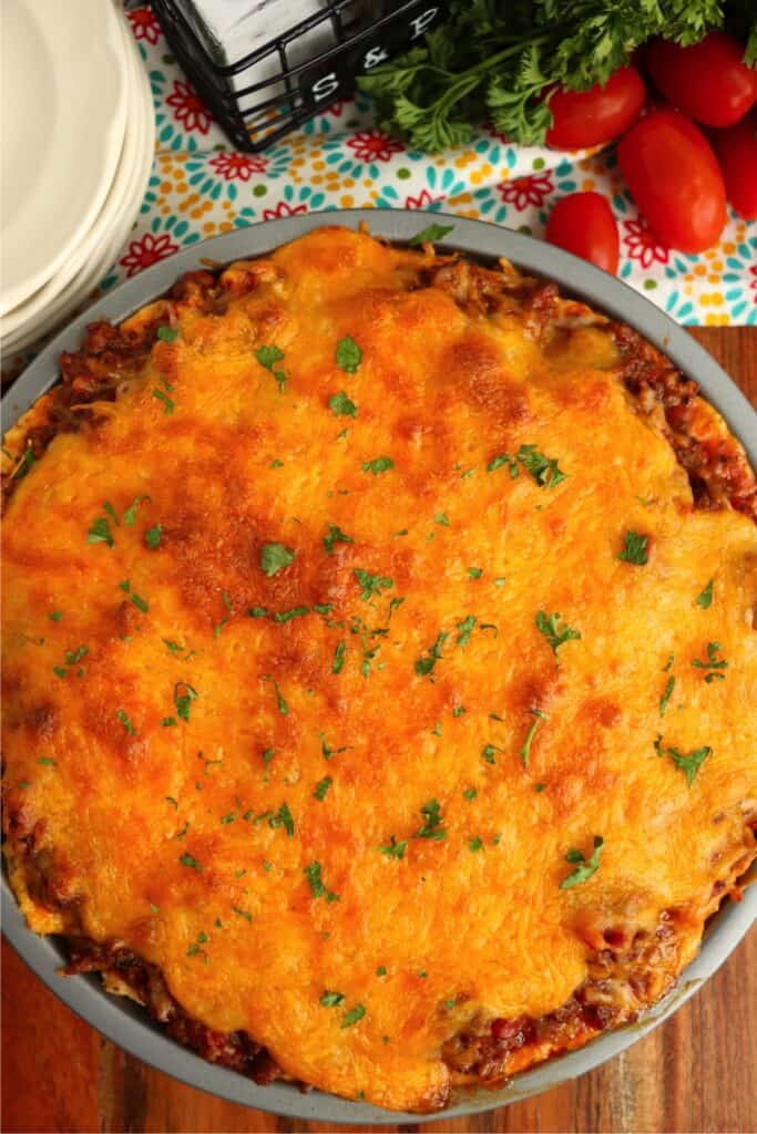 Overhead shot of golden baked spaghetti pie. 