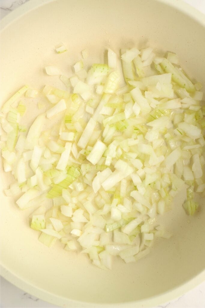 Overhead shot of onions in skillet. 