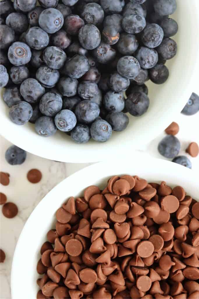  Closeup overhead shot of two bowls full of blueberries and chocolate chips