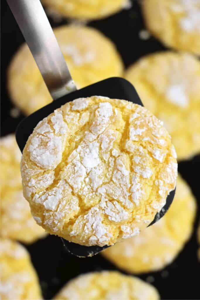 Closeup overhead shot of lemon Cool Whip cookie on spatula. 
