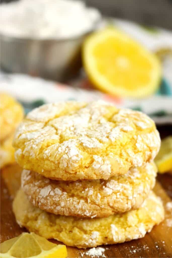 Closeup shot of lemon cake mix cookies stacked atop one another. 