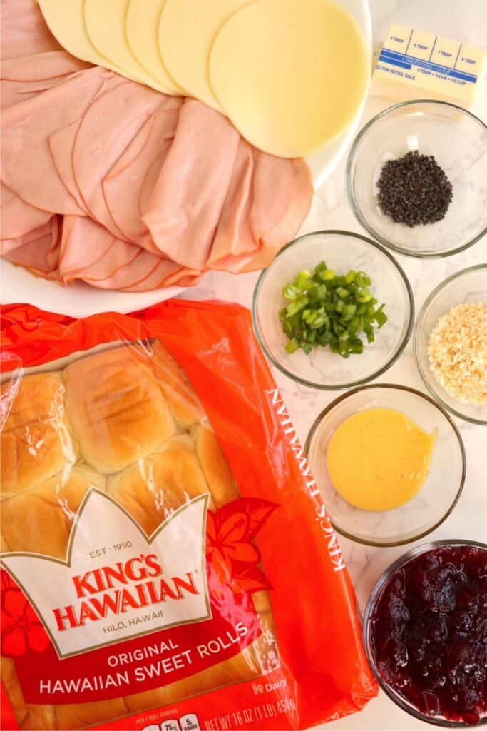 Overhead shot of individual turkey cranberry slider ingredients on table. 