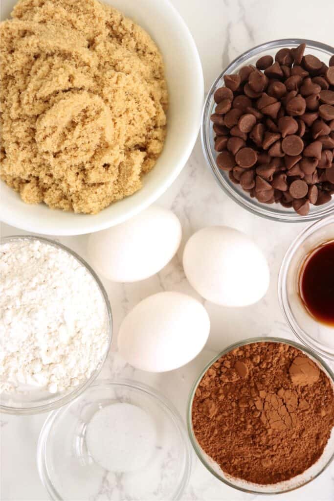 Overhead shot of individual brownie ingredients in bowls. 
