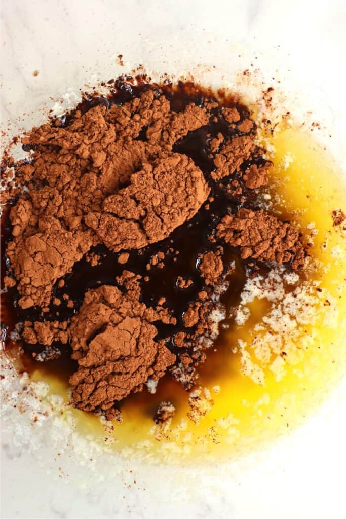 Overhead shot of bowlful of melted butter, cocoa, and vanilla. 
