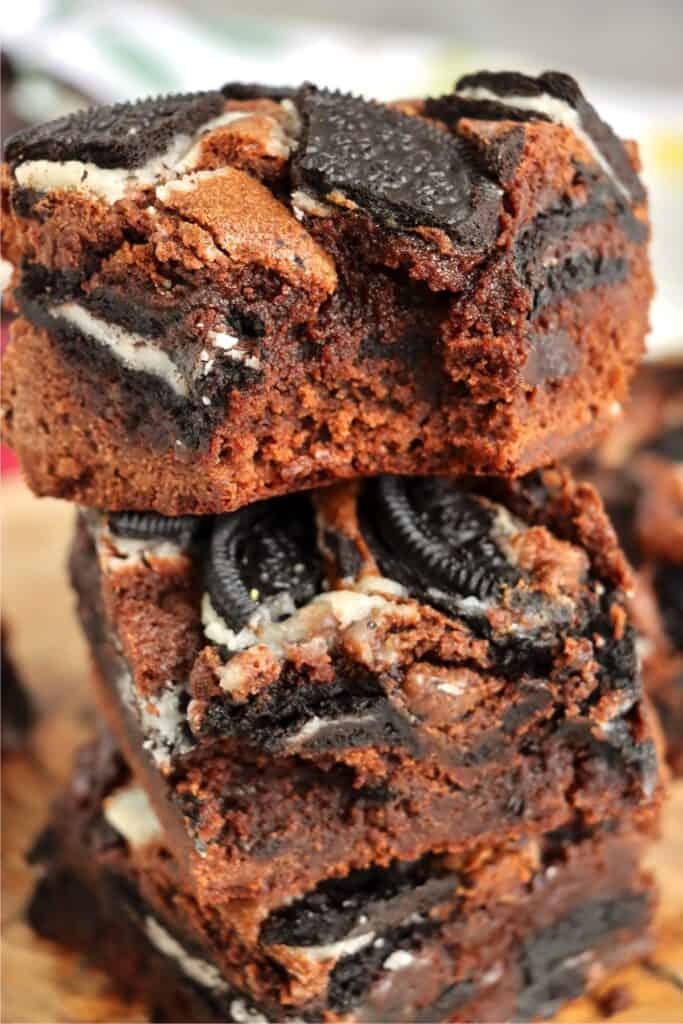 Closeup shot of stack of Oreo brownies with bite taken out of top brownie