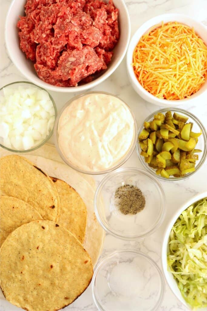 Overhead shot of individual Big Mac crunch wrap ingredients. 