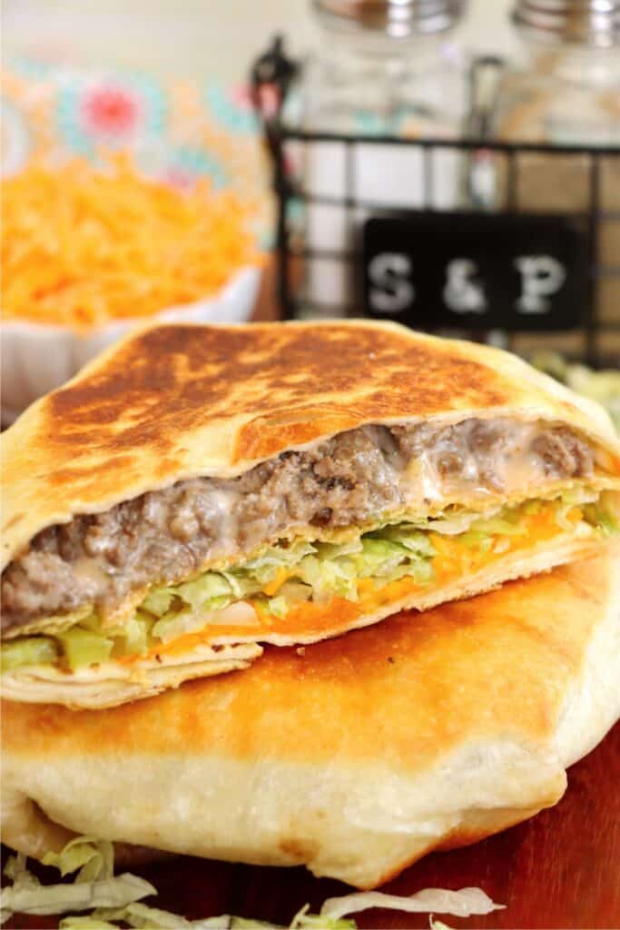 Closeup shot of Big Mac crunch wrap cut in half. 