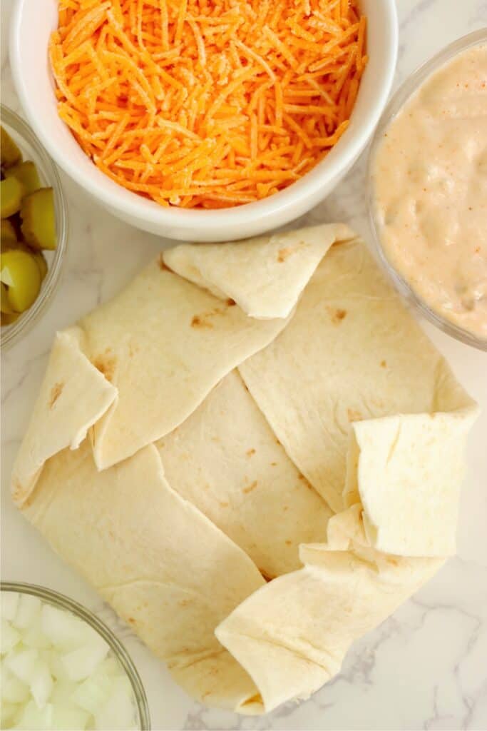 Overhead shot of uncooked Big Mac crunch wrap. 