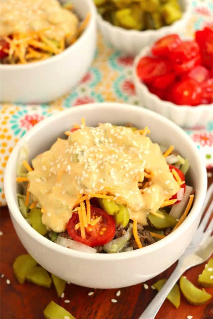 Big Mac in a bowl topped with Big Mac sauce.