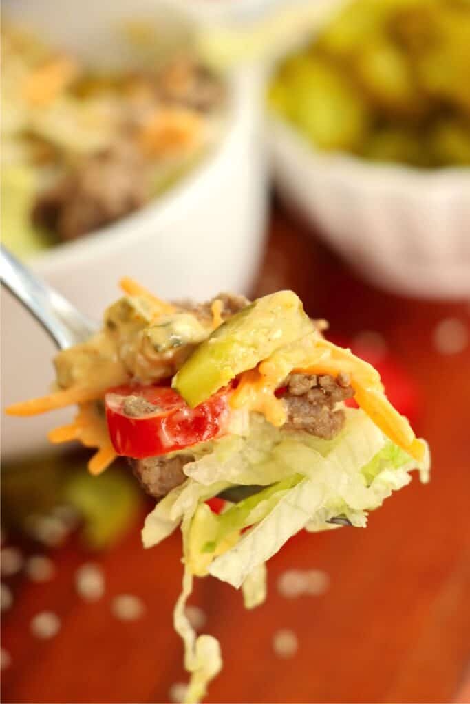 Closeup shot of forkful of Big Mac salad.