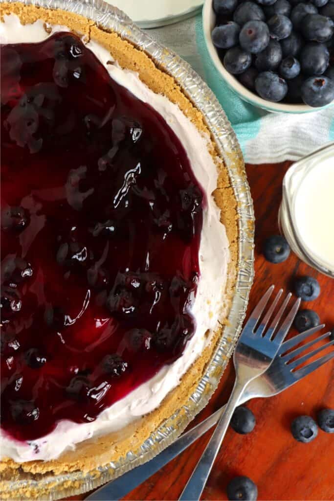 Overhead shot of blueberry cream cheese pie topped with blueberry pie filling. 