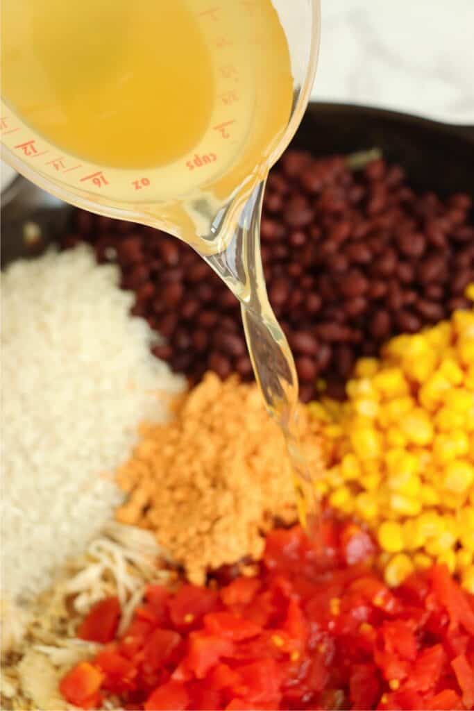 Closeup shot of chicken casserole ingredients in skillet.