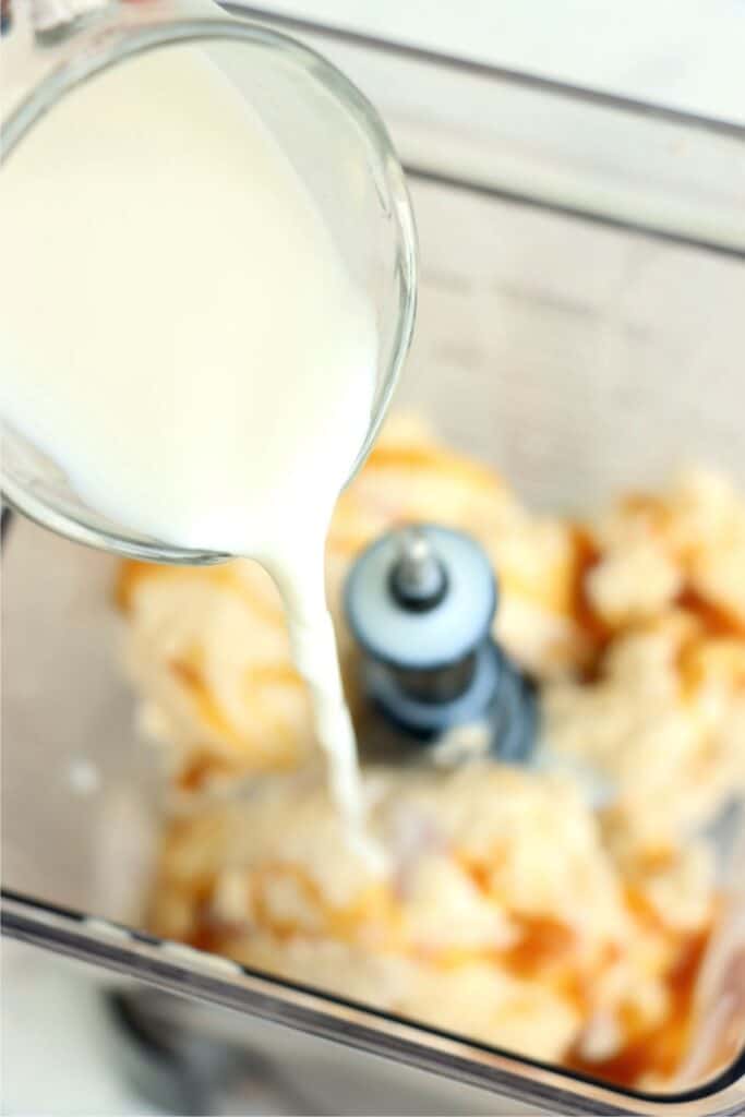 Overhead shot of blender with salted caramel milkshake ingredients
